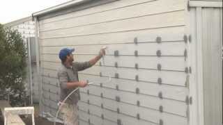 How To Spray A House  Airless spray painting exterior walls [upl. by Aicelaf]