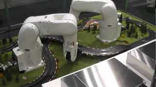 DENSO Robotics  Robots lay out slotcar track [upl. by Evy]